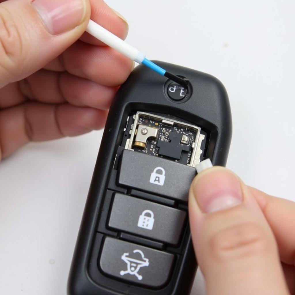 Cleaning the 2013 Toyota RAV4 Limited Key Fob Battery Contacts