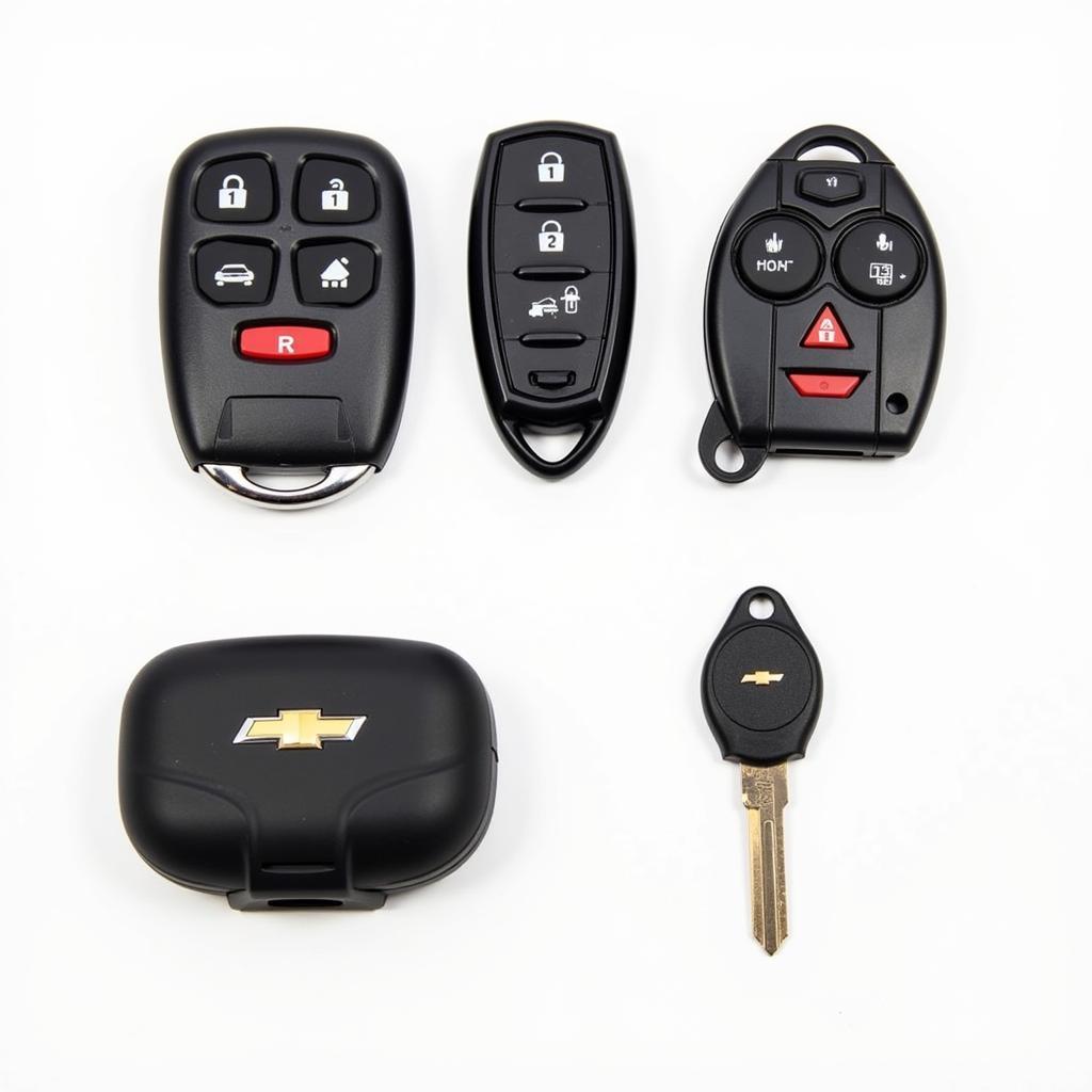 Different types of Chevy HHR key fobs and a protective case