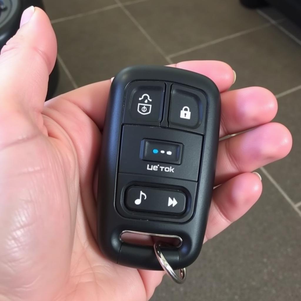 Holding a new Jeep Grand Cherokee key fob