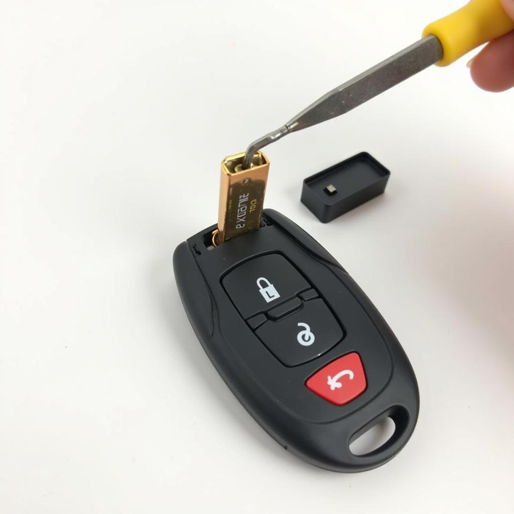 Removing the old battery from a VW Passat key fob