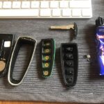 Ford key fob disassembled to show internal components for repair