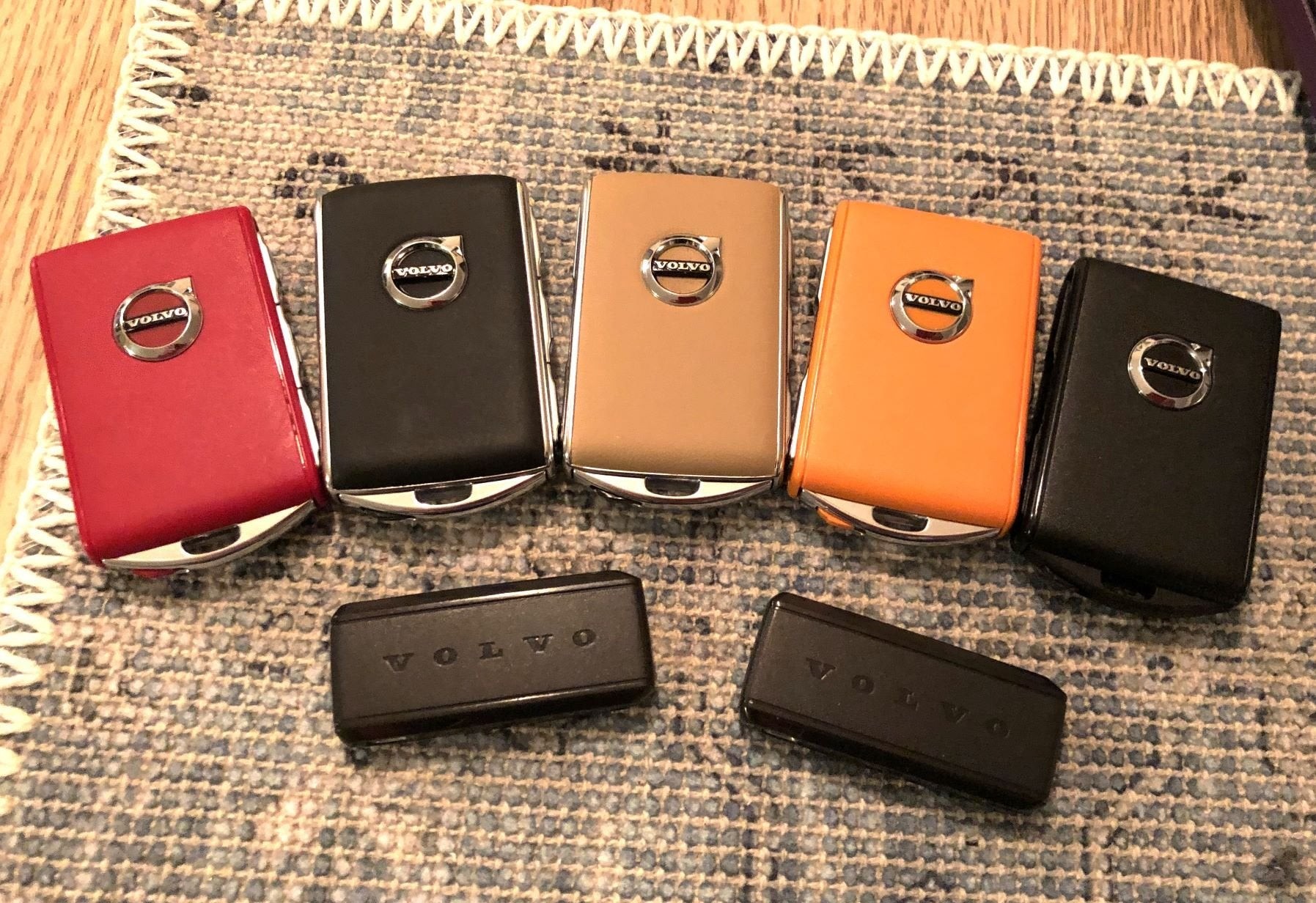 Assortment of Volvo key fobs illustrating different styles and conditions.