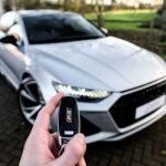 Person holding an Audi key fob