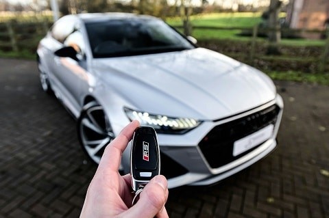 Person holding an Audi key fob