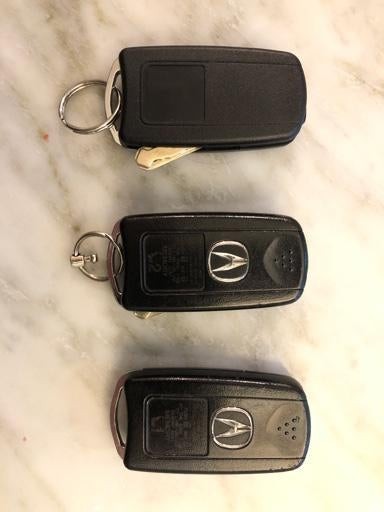 Acura MDX key fob options showing different button configurations for SUV liftgate and car trunk, part number variations