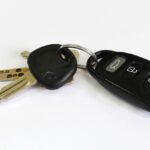 Car keys with a modern key fob showcasing a typical design and button layout