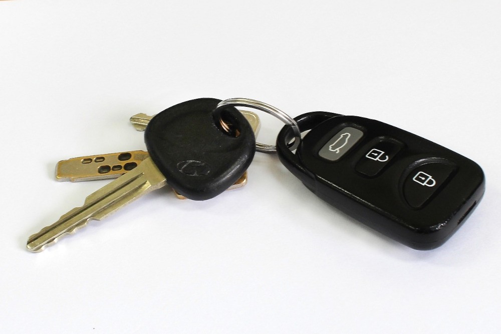 Car keys with a modern key fob showcasing a typical design and button layout