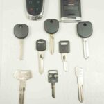 Various car key types including a transponder key and key fob, relevant for Chevy Cruze key replacement options.