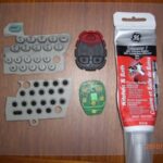 Disassembled key fob remote with tools