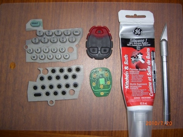 Disassembled key fob remote and tools