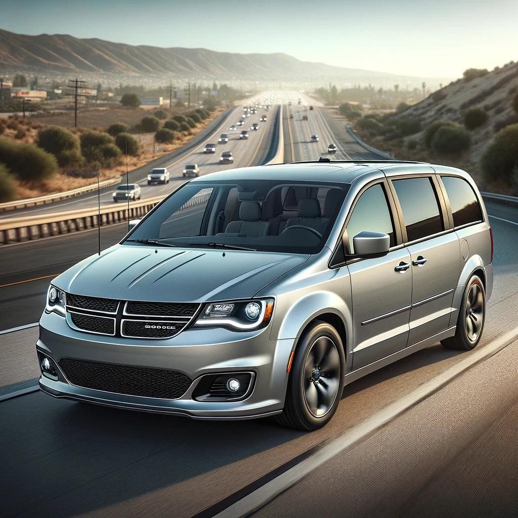 Silver Dodge Grand Caravan driving on a highway, representing modern vehicle key fob technology.