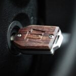 Custom hardwood and aluminum key fob showcasing craftsmanship and design.