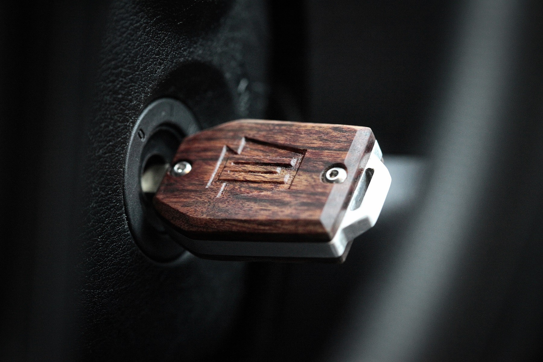 Custom hardwood and aluminum key fob showcasing craftsmanship and design.