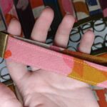 Close-up of a handmade key fob wristlet showcasing fabric and hardware