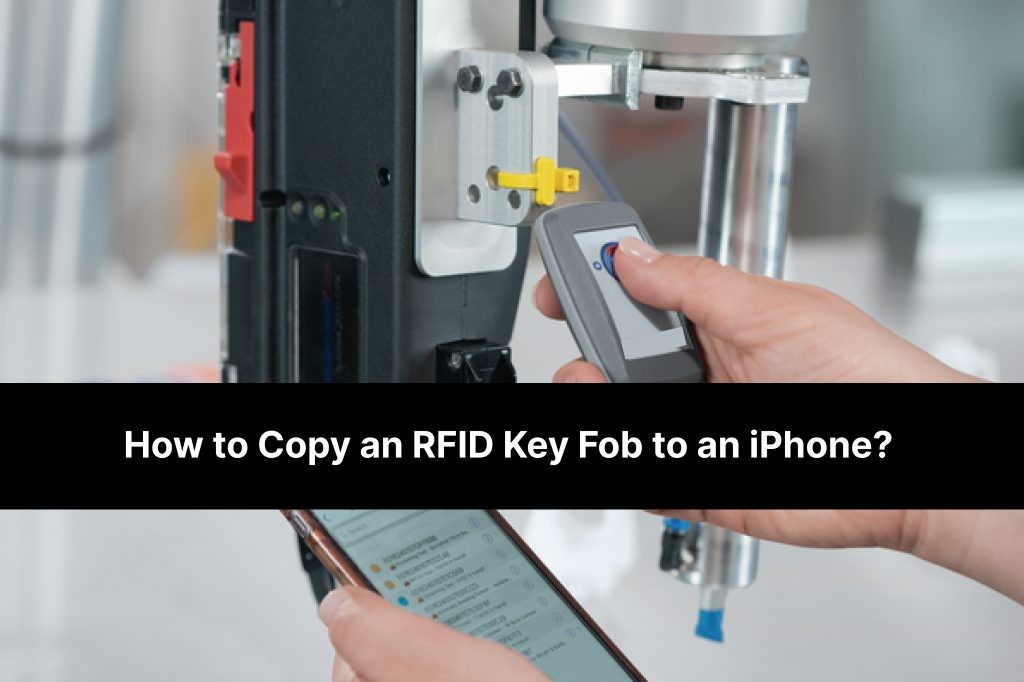 Close up of a person using an iphone to scan an rfid key fob, demonstrating the process of copying a key fob to a phone.