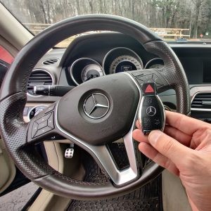 Expert key fob locksmith near me programming a Mercedes-Benz car key