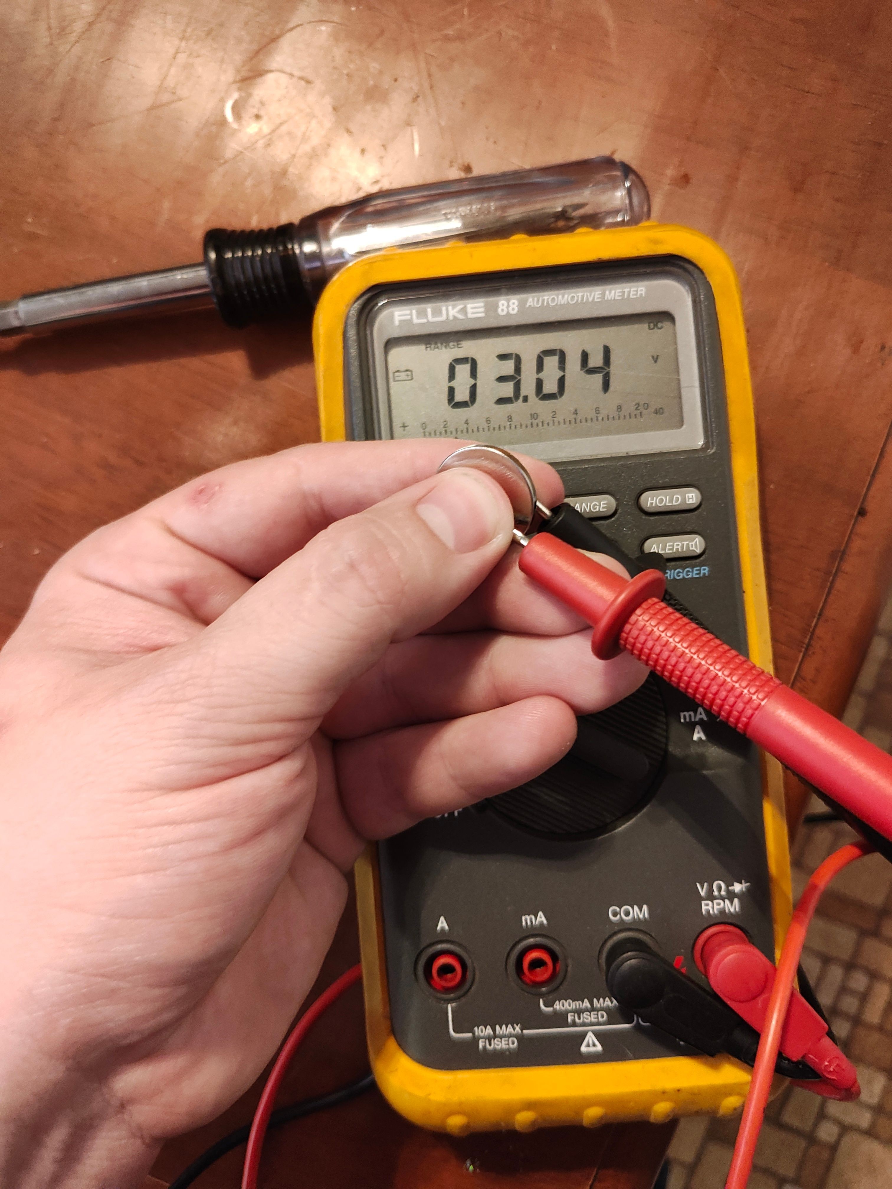 Testing key fob battery with a multimeter