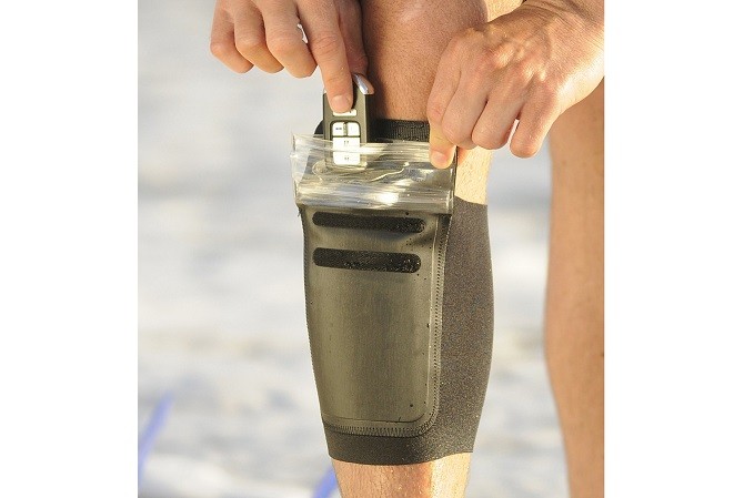 The DRFT waterproof leg pouch, showcasing its unique design for carrying key fobs during water activities.