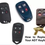 Close-up of an ADT security key fob, relevant to guide on replacing lost fobs.